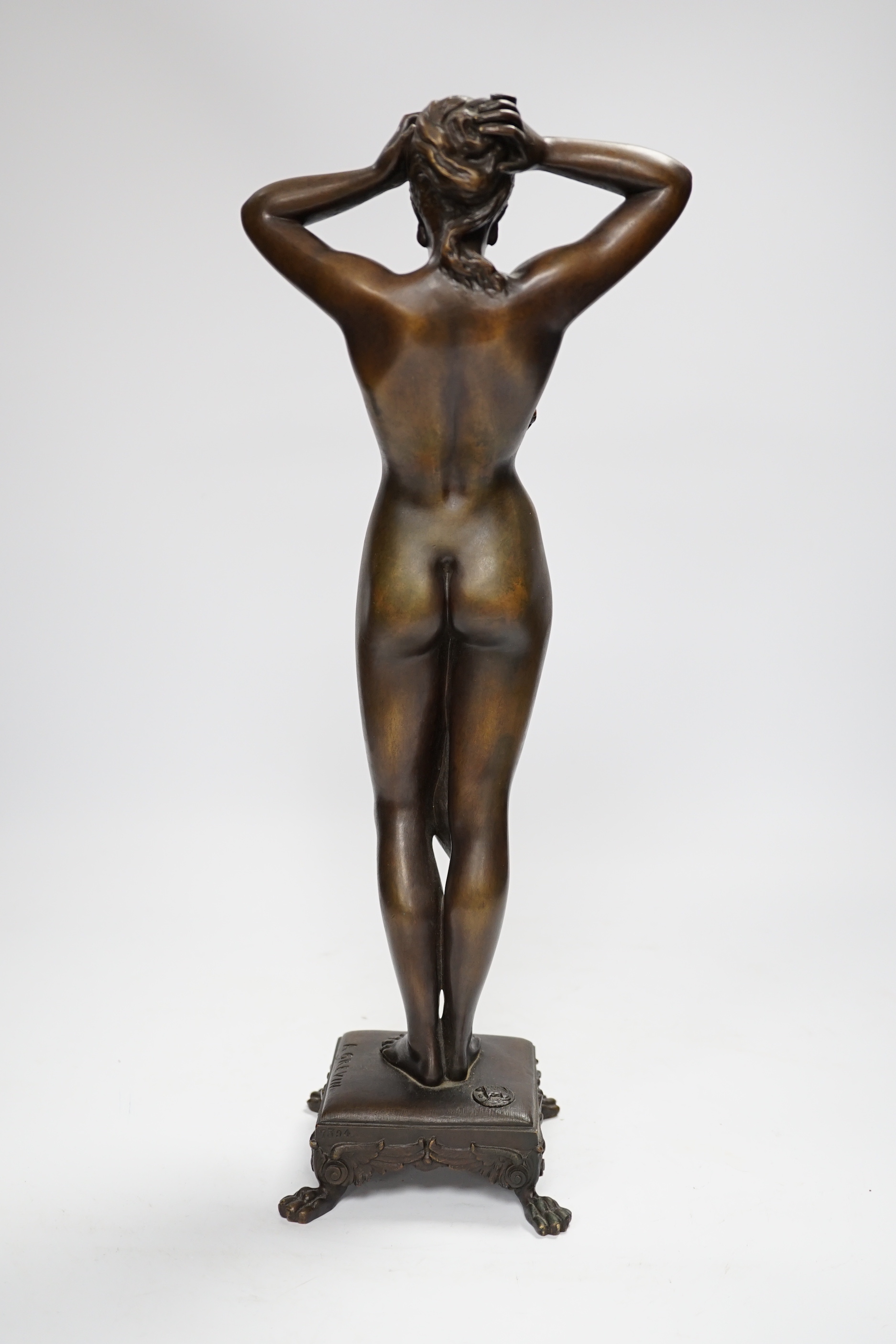 After Alfred Grevin (French, 1827-1892). A bronze study of an Art Nouveau female nude, signed to base, 41cm high